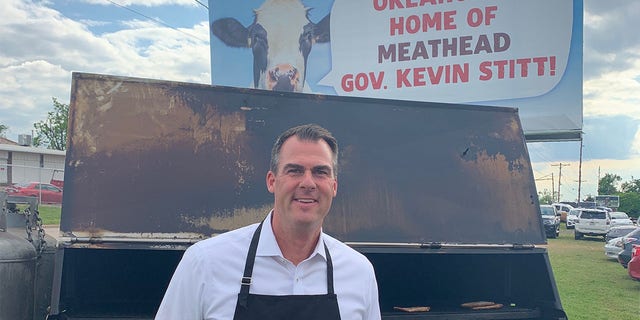 Gov. Stitt Enjoys Grilling Hamburgers Beneath Peta Billboard Calling Him a Meathead