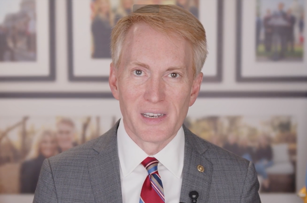 Senator Lankford sitting in his DC Office with pics behind him. 