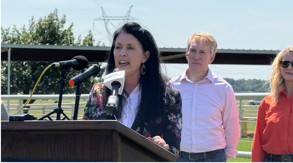Ag Secretary Blayne Arthur at the podium with Senator James Lankford behind her